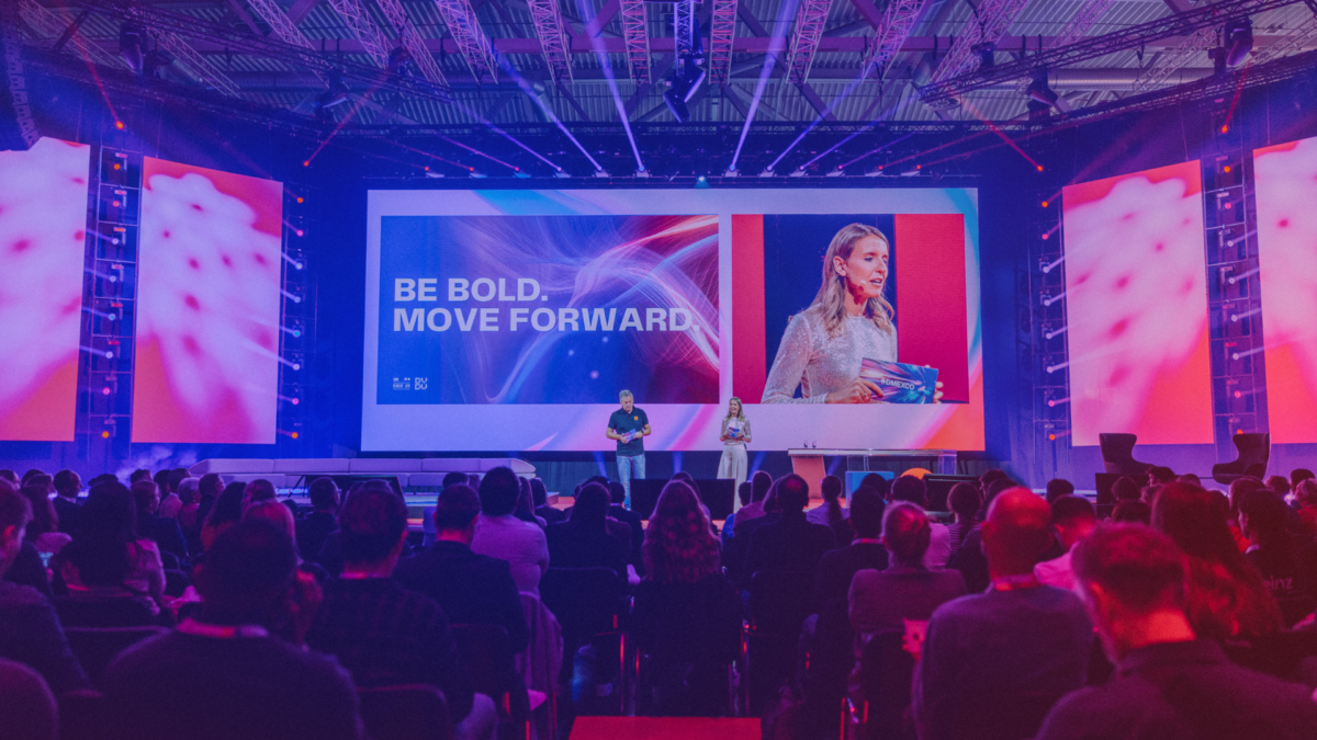 Be bold. Move forward. A photo of the motto displayed onstage, symbolizing lessons learned at DMEXCO 2025.