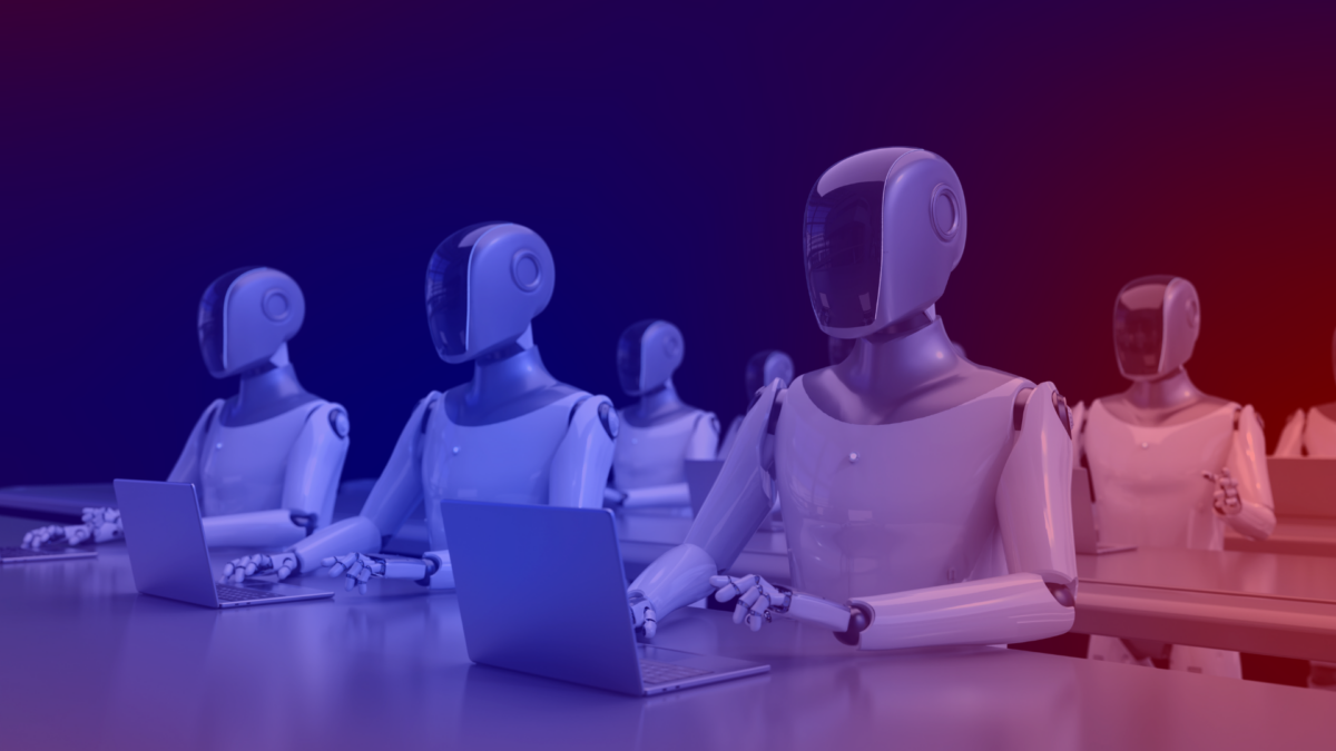 : Multiple robots working on laptops – symbolic image for AdCP and AI-powered advertising automation.
