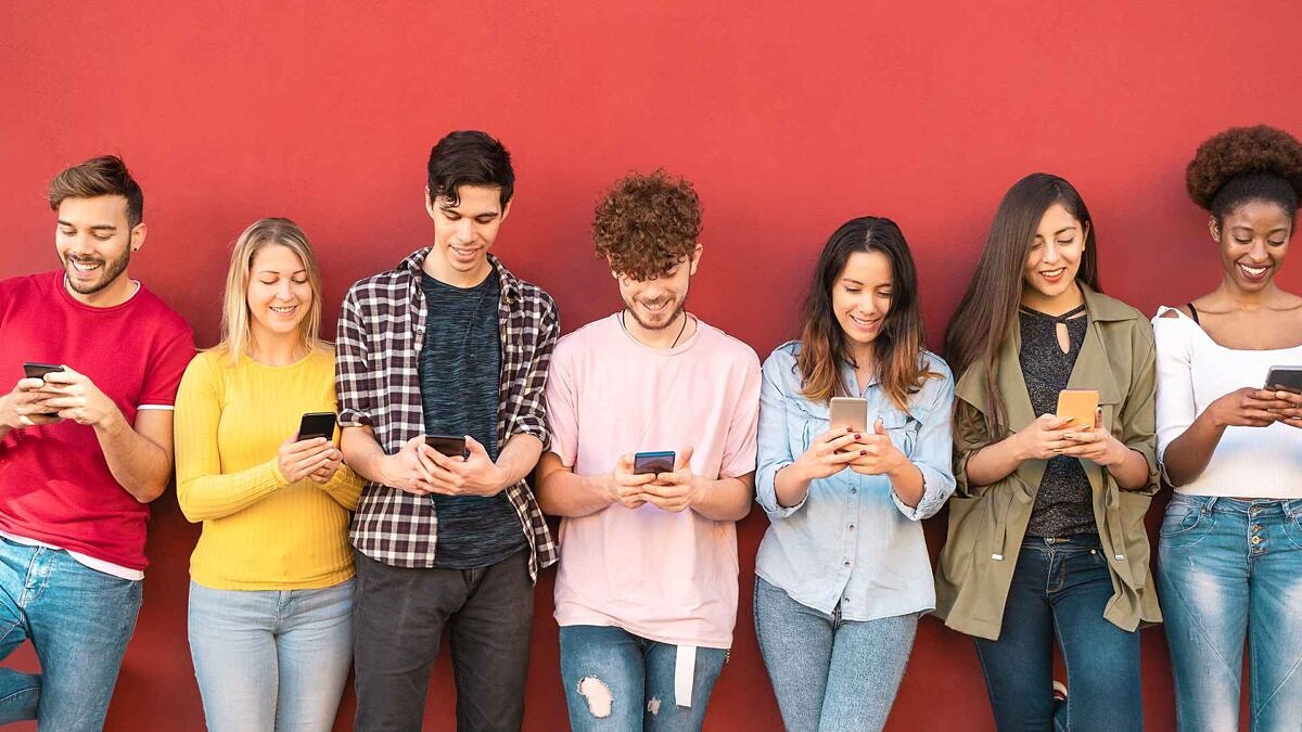 PwC study: A group of different people do online shopping with their smartphones.