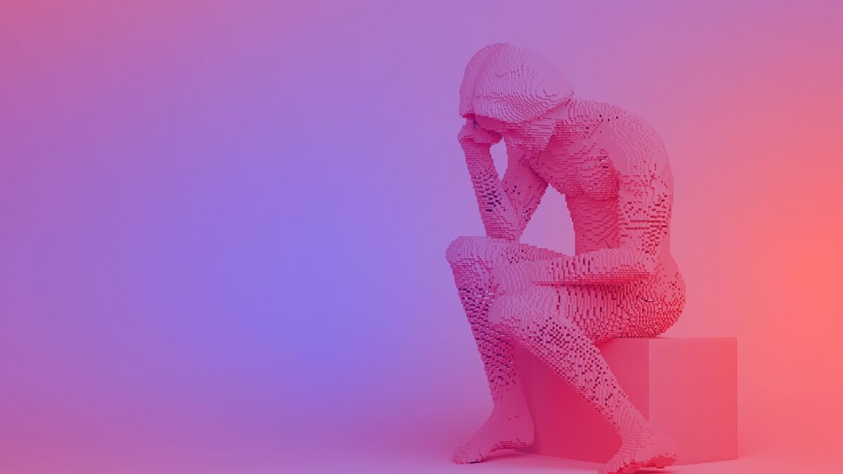 Marketing Relevance: A replica of the sculpture “The Thinker” made of pink building blocks, sitting on a plinth against a colorful gradient background.