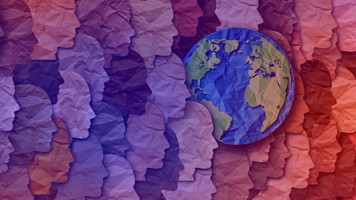 Artistic representation of the globe and paper people to celebrate Earth Day on April 22 