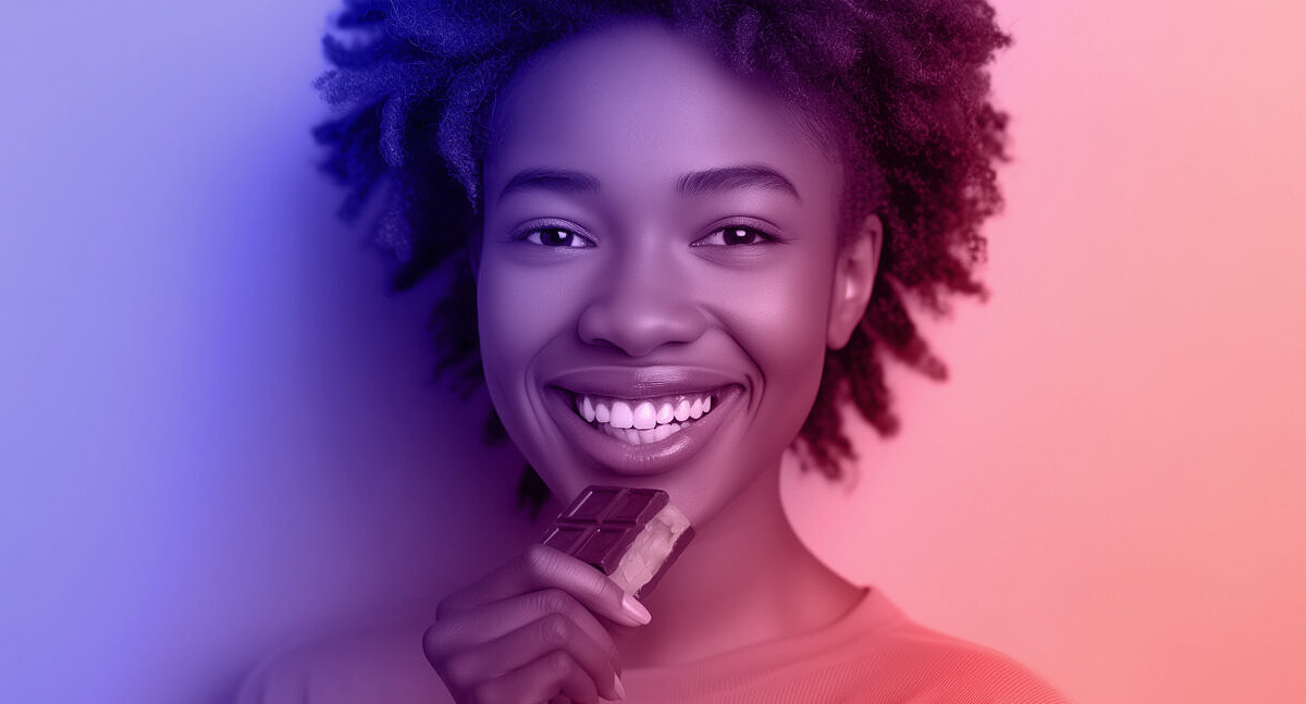 A marketing success story: Dubai chocolate craze – woman eating the exclusive chocolate confection.