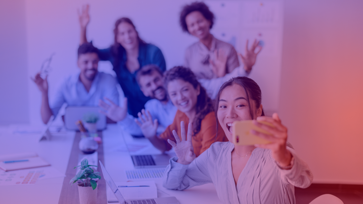 Employees post a picture from a meeting.