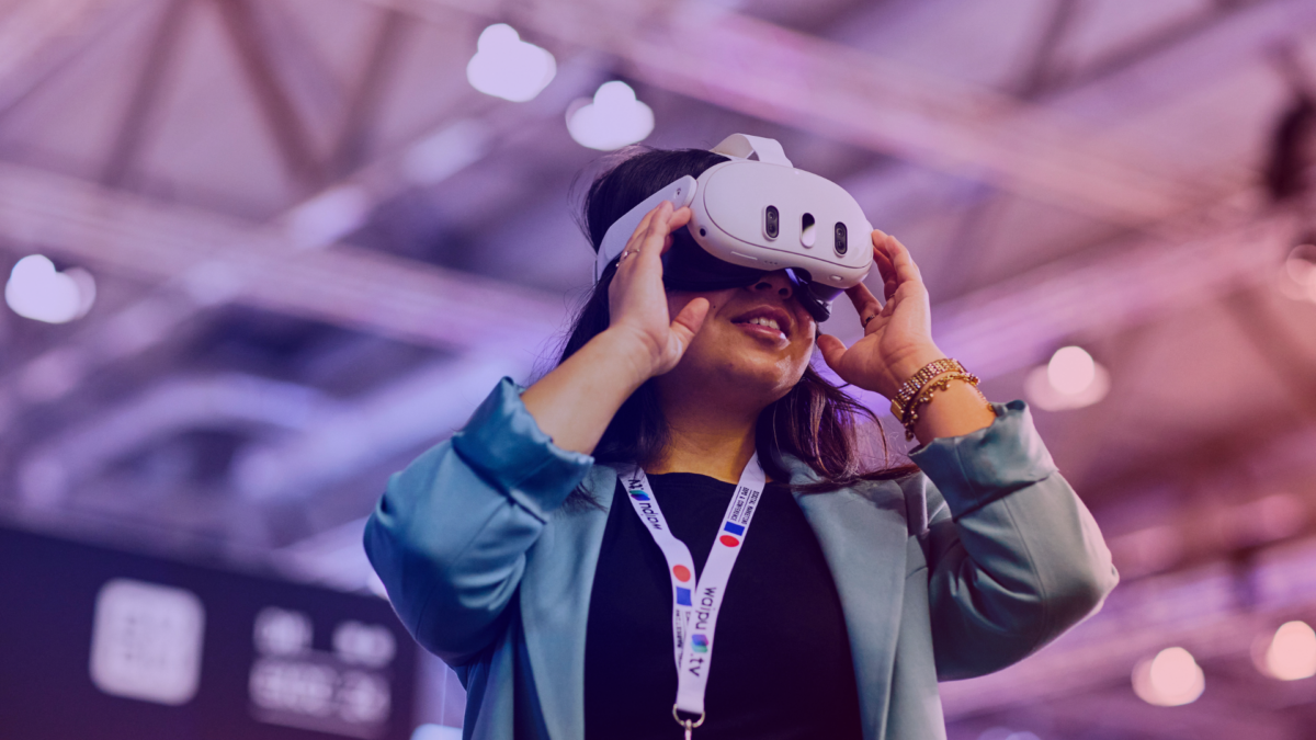 A woman with a VR headset experiences immersive technology in the tech area at DMEXCO 2025